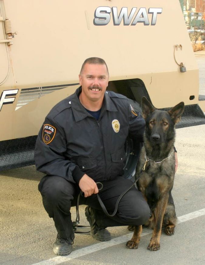 Schaffer and Faust near a SWAT vehicle. 